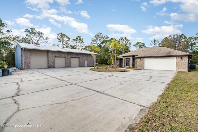 view of front of home featuring a garage and a front lawn