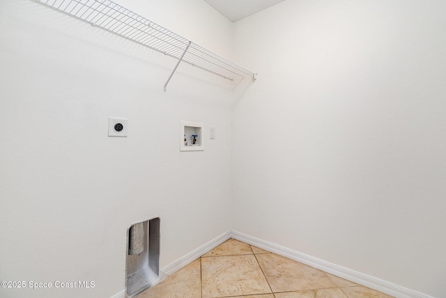 washroom with hookup for an electric dryer, tile patterned flooring, and hookup for a washing machine