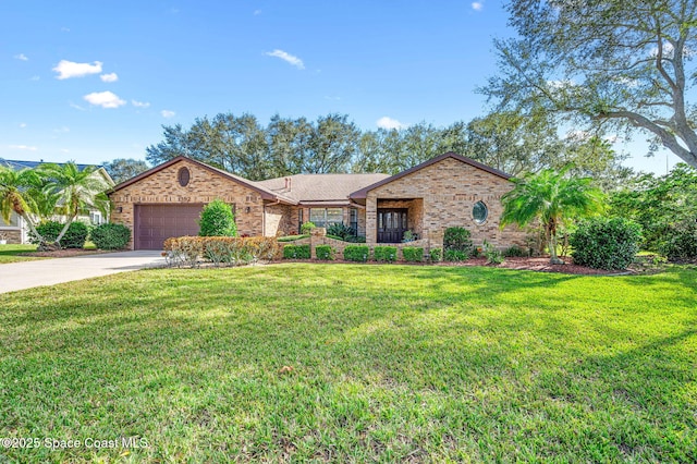 view of front of property with a garage and a front lawn