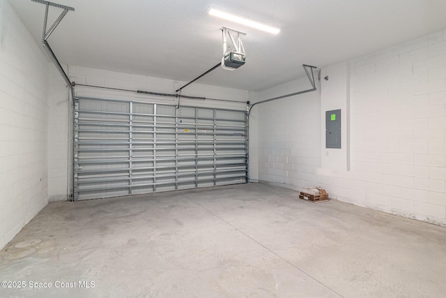 garage featuring electric panel and a garage door opener