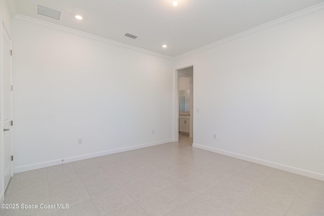 spare room featuring ornamental molding