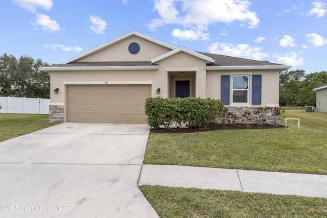 ranch-style house with a garage and a front yard