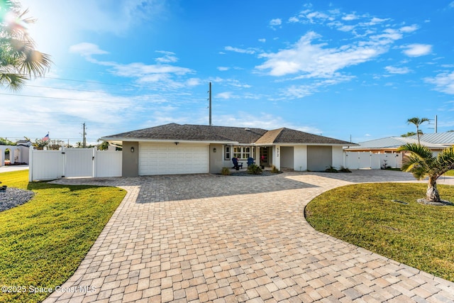 ranch-style home featuring a front yard and a garage