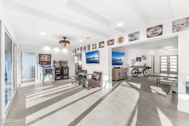 living room featuring french doors and light tile patterned floors