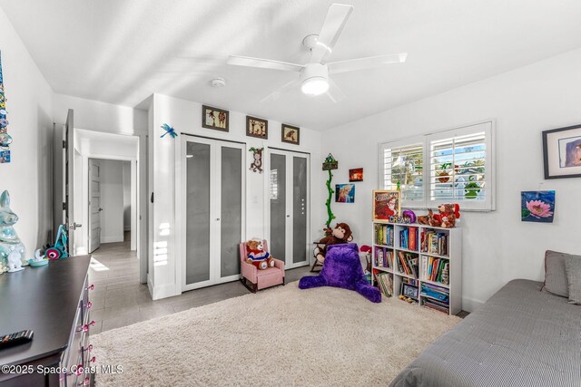 bedroom with light colored carpet and ceiling fan