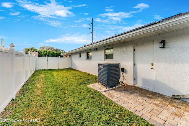 view of yard with a patio area and central AC