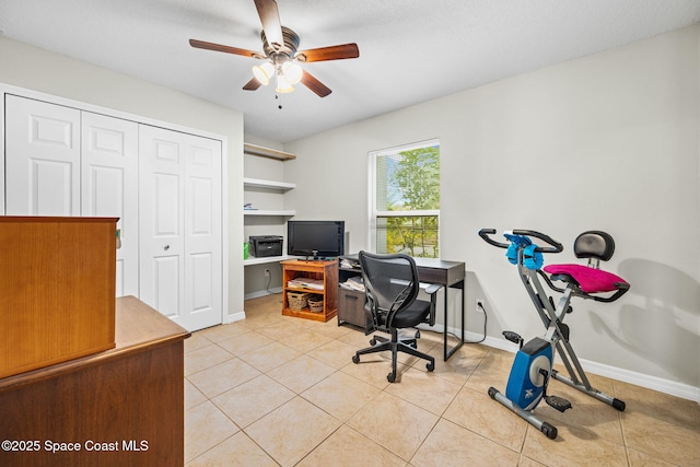 office area featuring a textured ceiling, ceiling fan, and light tile patterned floors