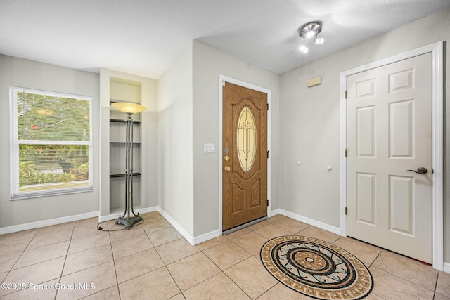 entryway featuring light tile patterned floors