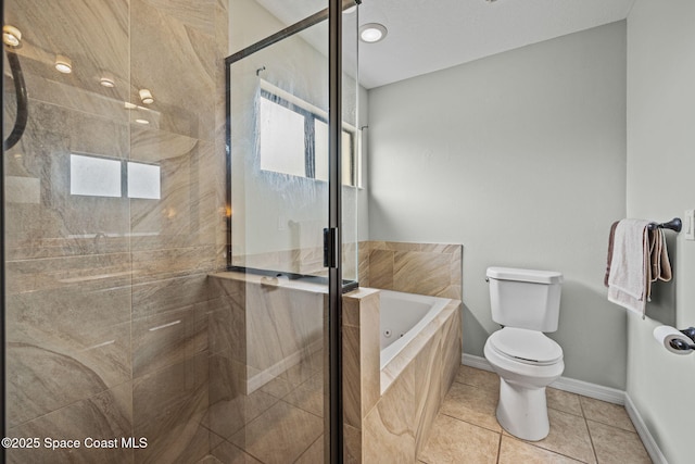 bathroom featuring toilet, tile patterned floors, plenty of natural light, and plus walk in shower