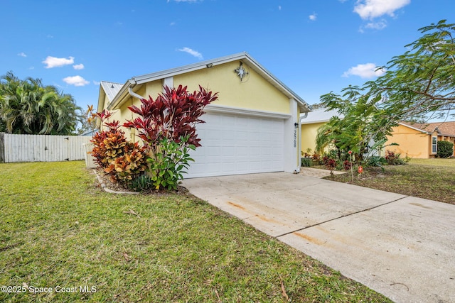 view of front of house with a front yard and a garage