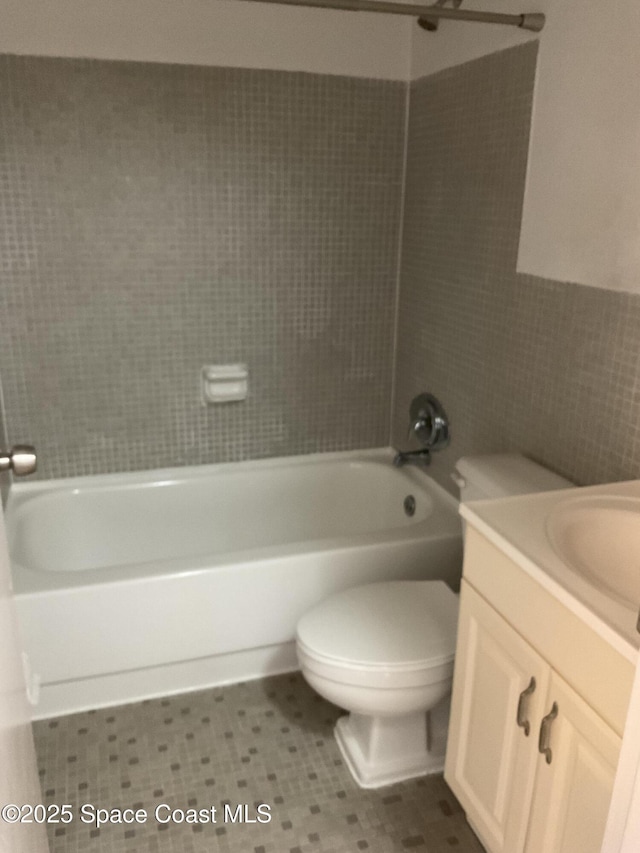 full bathroom with vanity, toilet, and shower / tub combination