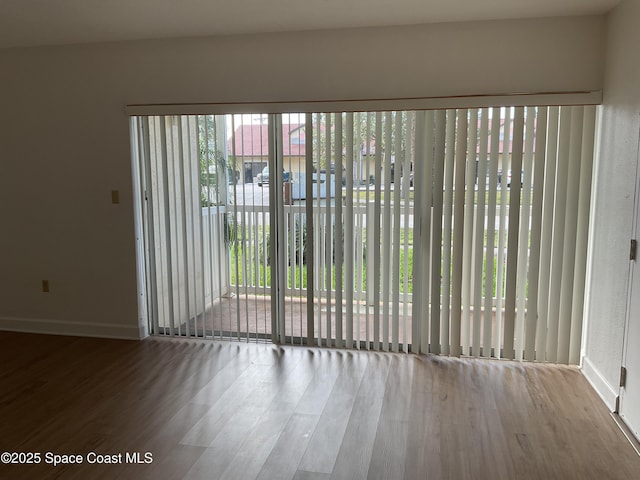 spare room featuring hardwood / wood-style floors