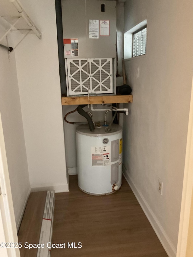 utility room featuring electric water heater