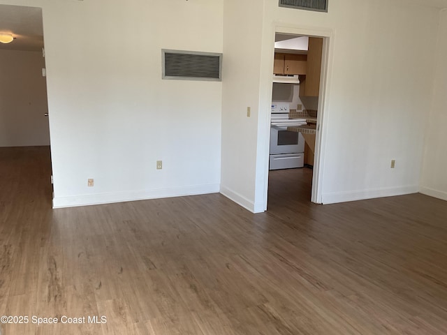 unfurnished living room featuring dark wood-type flooring