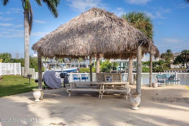 view of home's community with a gazebo and a patio area