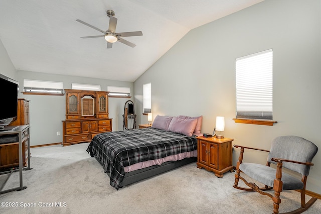 bedroom featuring ceiling fan, lofted ceiling, and light carpet