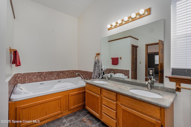 bathroom featuring a bathtub and vanity