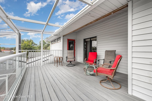 wooden deck featuring a lanai