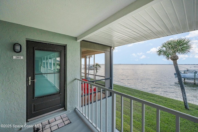 exterior space with a water view and a yard