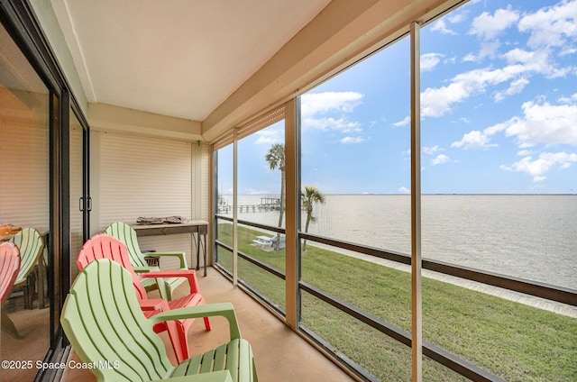 sunroom with a water view