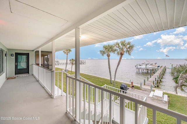 exterior space with a grill and a water view