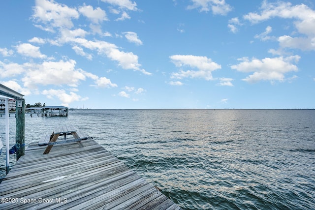 view of dock with a water view