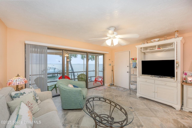 living room featuring ceiling fan