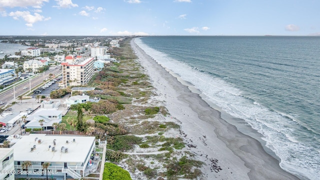 bird's eye view with a water view and a view of the beach