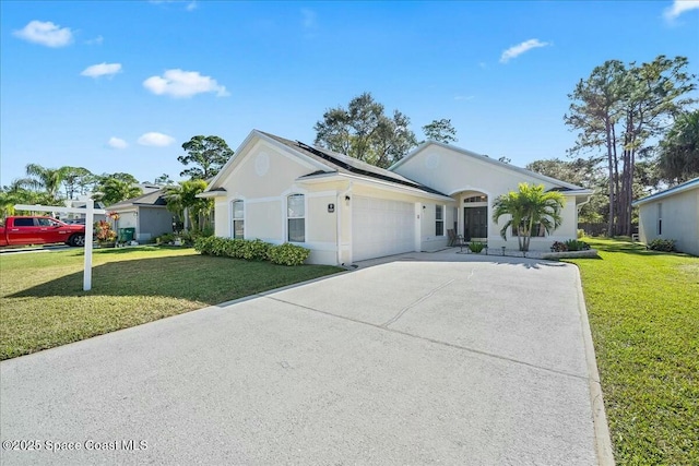 ranch-style house with a garage, a front yard, and solar panels