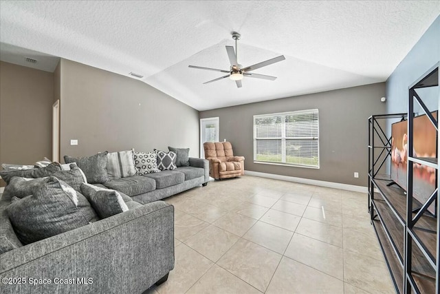 tiled living room with a textured ceiling, ceiling fan, and lofted ceiling