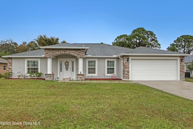 view of front of house featuring a front yard and a garage