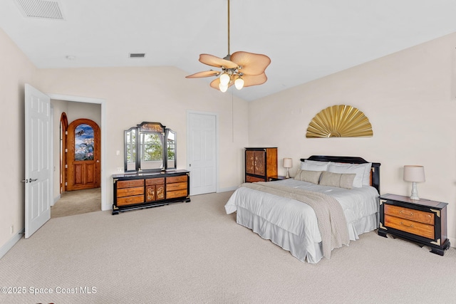 carpeted bedroom with lofted ceiling and ceiling fan