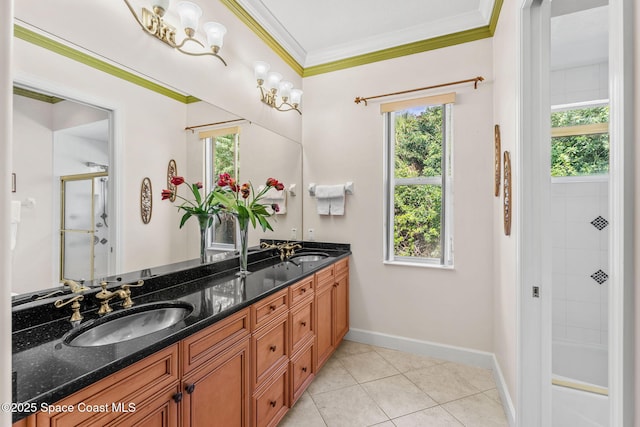 bathroom featuring vanity, tile patterned flooring, and crown molding