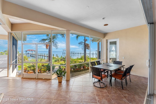 sunroom with a water view