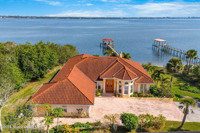 birds eye view of property featuring a water view