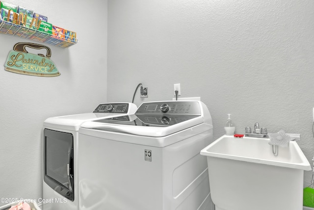 laundry area featuring sink and independent washer and dryer