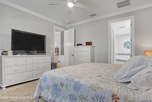 carpeted bedroom featuring ceiling fan, ensuite bathroom, and ornamental molding