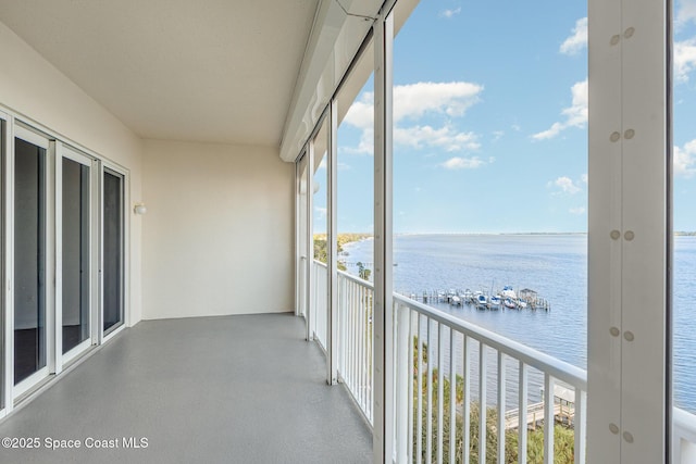 balcony featuring a water view