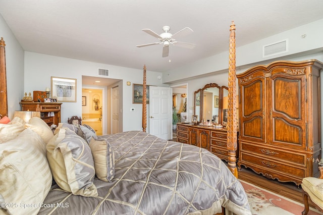 bedroom with ceiling fan and ensuite bath