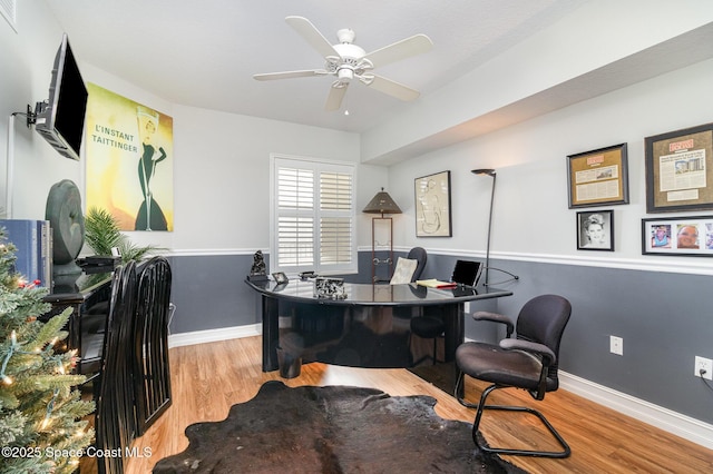 office area with light wood-type flooring and ceiling fan