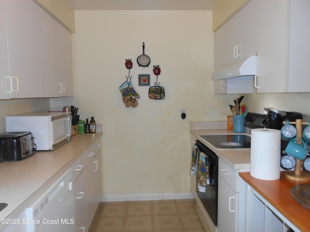 kitchen with white appliances and white cabinetry