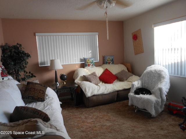 bedroom with ceiling fan and carpet