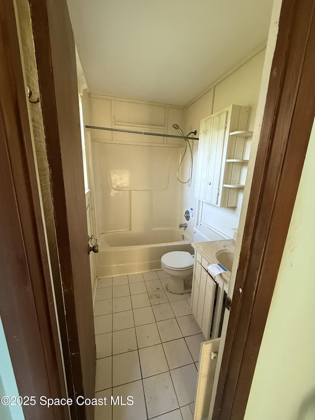 full bathroom with tile patterned floors, vanity, shower / bathtub combination, and toilet