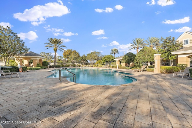 view of swimming pool with a patio area