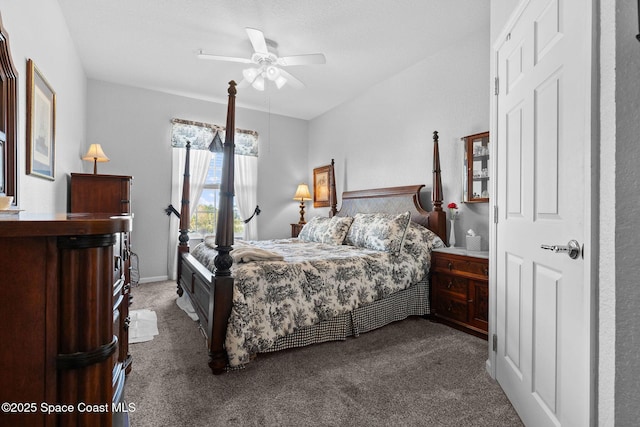 bedroom featuring dark carpet