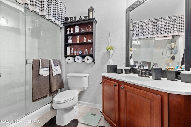 bathroom featuring vanity, an enclosed shower, tile patterned floors, and toilet