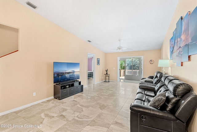 living room with ceiling fan and lofted ceiling