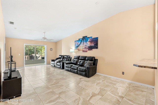 living room with ceiling fan and lofted ceiling