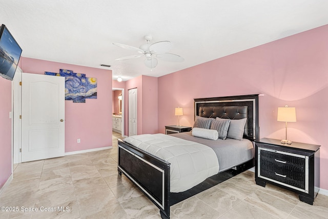 bedroom featuring ensuite bathroom and ceiling fan