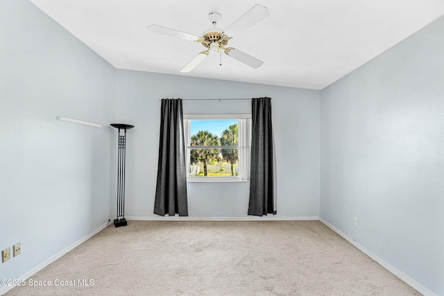 empty room with light carpet, ceiling fan, and lofted ceiling